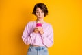 Portrait of astonished cute sweet teen girl use smartphone follow social network website impressed unbelievable news Royalty Free Stock Photo