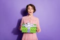 Portrait of astonished girl hold gift box dont wait present from her boyfriend on 8-march stare stupor wear polka-dot