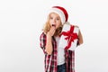 Portrait of an astonished little girl holding gift box Royalty Free Stock Photo