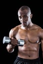 Portrait of athlete exercising with dumbbell Royalty Free Stock Photo