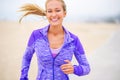 Portrait, athlete or happy woman at beach running for exercise, training or fitness workout at sea. Sports, excited Royalty Free Stock Photo