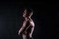 Portrait of an athletic african american man topless, black background Royalty Free Stock Photo