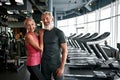 Good-looking elderly fit couple posing in gym Royalty Free Stock Photo