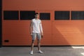 Portrait athletic, muscular man preparing for warming up with jumping rope