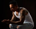 Portrait of athletic young tattooed guy. Studio shot Royalty Free Stock Photo