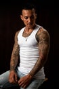 Portrait of athletic young tattooed guy. Studio shot Royalty Free Stock Photo