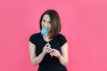 Portrait of atractive happy girl biting big round red lollipop . Sweet tooth. Teenager girl enjoying life. Sweets. Dieting. Royalty Free Stock Photo