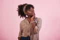 Portrait of attractive african american girl in casual clothing and watch on hand posing for the camera Royalty Free Stock Photo