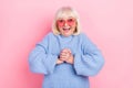 Portrait of attractive amazed cheerful grey-haired woman great news reaction isolated over pink pastel color background Royalty Free Stock Photo