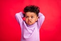 Portrait of attractive annoyed angry boy bad mood reaction fail isolated over vibrant red color background Royalty Free Stock Photo