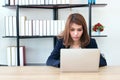 Portrait of attractive Asian business woman working with laptop in office Royalty Free Stock Photo