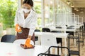 Waitress cleaning table, New Normal Restaurant concept