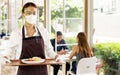 Asian waitress serving food new normal