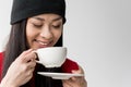 Portrait of attractive asian woman holding tea cup isolated Royalty Free Stock Photo