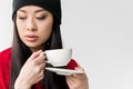 Portrait of attractive asian woman holding tea cup isolated Royalty Free Stock Photo