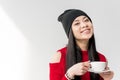 Portrait of attractive asian woman holding tea cup isolated Royalty Free Stock Photo