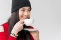 Portrait of attractive asian woman holding tea cup isolated Royalty Free Stock Photo