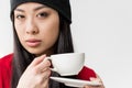 Portrait of attractive asian woman holding tea cup isolated Royalty Free Stock Photo