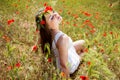 Portrait of an attractive beautiful girl in a poppy field Royalty Free Stock Photo