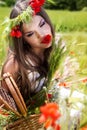 Portrait of an attractive beautiful girl in a poppy field Royalty Free Stock Photo