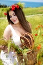 Portrait of an attractive beautiful girl in a poppy field Royalty Free Stock Photo