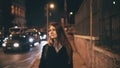 Portrait of attractive beautiful woman walking in the city centre near the Colosseum in Rome, Italy late at night. Royalty Free Stock Photo