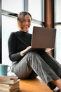 Beautiful young Asian woman or female freelancer using laptop computer Royalty Free Stock Photo