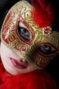 Portrait of attractive beautiful young woman wearing gold carnival mask Royalty Free Stock Photo