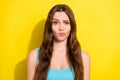 Portrait of attractive bewildered puzzled unsure girl oops reaction over bright yellow color background
