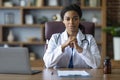 Portrait of attractive black woman doctor posing at clinic Royalty Free Stock Photo