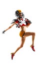 female american football player in uniform and jersey T-shirt posing with helmet isolated on white background Royalty Free Stock Photo