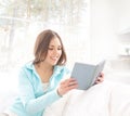 Portrait of an attractive brunette reading a book Royalty Free Stock Photo