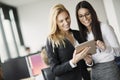 Portrait of attractive businesswomen using digital tablet