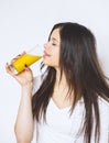 Portrait of attractive caucasian smiling woman isolated on white studio shot drinking orange juice face skin. Portrait of a pretty Royalty Free Stock Photo