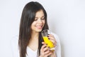 Portrait of attractive caucasian smiling woman isolated on white studio shot drinking orange juice face skin. Portrait of a pretty Royalty Free Stock Photo