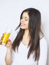 Portrait of attractive caucasian smiling woman isolated on white studio shot drinking orange juice face skin. Portrait of a pretty Royalty Free Stock Photo