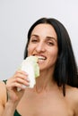 portrait of attractive caucasian smiling woman isolated on white studio shot eating salat