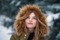 Portrait of attractive caucasian young girl wearing jacket with hood Royalty Free Stock Photo