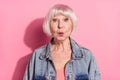 Portrait of attractive cheerful amazed funny grey-haired woman pout lips isolated over pink pastel color background Royalty Free Stock Photo