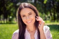 Portrait of attractive cheerful brunet girl enjoying good weather sunny day picnic village traveling sun shining bright Royalty Free Stock Photo