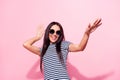 Portrait of attractive cheerful carefree woman dancing clubbing having fun isolated over pink pastel color background Royalty Free Stock Photo