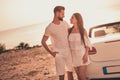 Portrait of attractive cheerful couple spending free time weekend getaway road trip adventure evening sunset outdoors Royalty Free Stock Photo