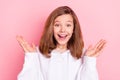 Portrait of attractive cheerful girl clapping palms applauding isolated over pink pastel color background