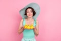 Portrait of attractive cheerful girl holding three yellow bath ducks isolated over pink pastel color background Royalty Free Stock Photo