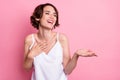 Portrait of attractive cheerful girl laughing having fun telling story isolated over pastel pink color background Royalty Free Stock Photo