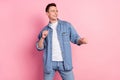 Portrait of attractive cheerful guy dancing having fun clubbing free time isolated over pink pastel color background Royalty Free Stock Photo