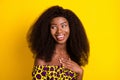 Portrait of attractive cheerful impressed girl laughing having fun over bright yellow color background