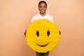 Portrait of attractive cheerful person hold big paper emoticon collage isolated on beige color background
