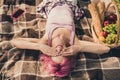 Portrait of attractive cheerful wavy-haired girl lying on veil spending free time nap closing eyes on fresh air outdoors Royalty Free Stock Photo