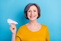 Portrait of attractive cheerful woman holding in hand paper plane send direction destination isolated over vivid blue Royalty Free Stock Photo